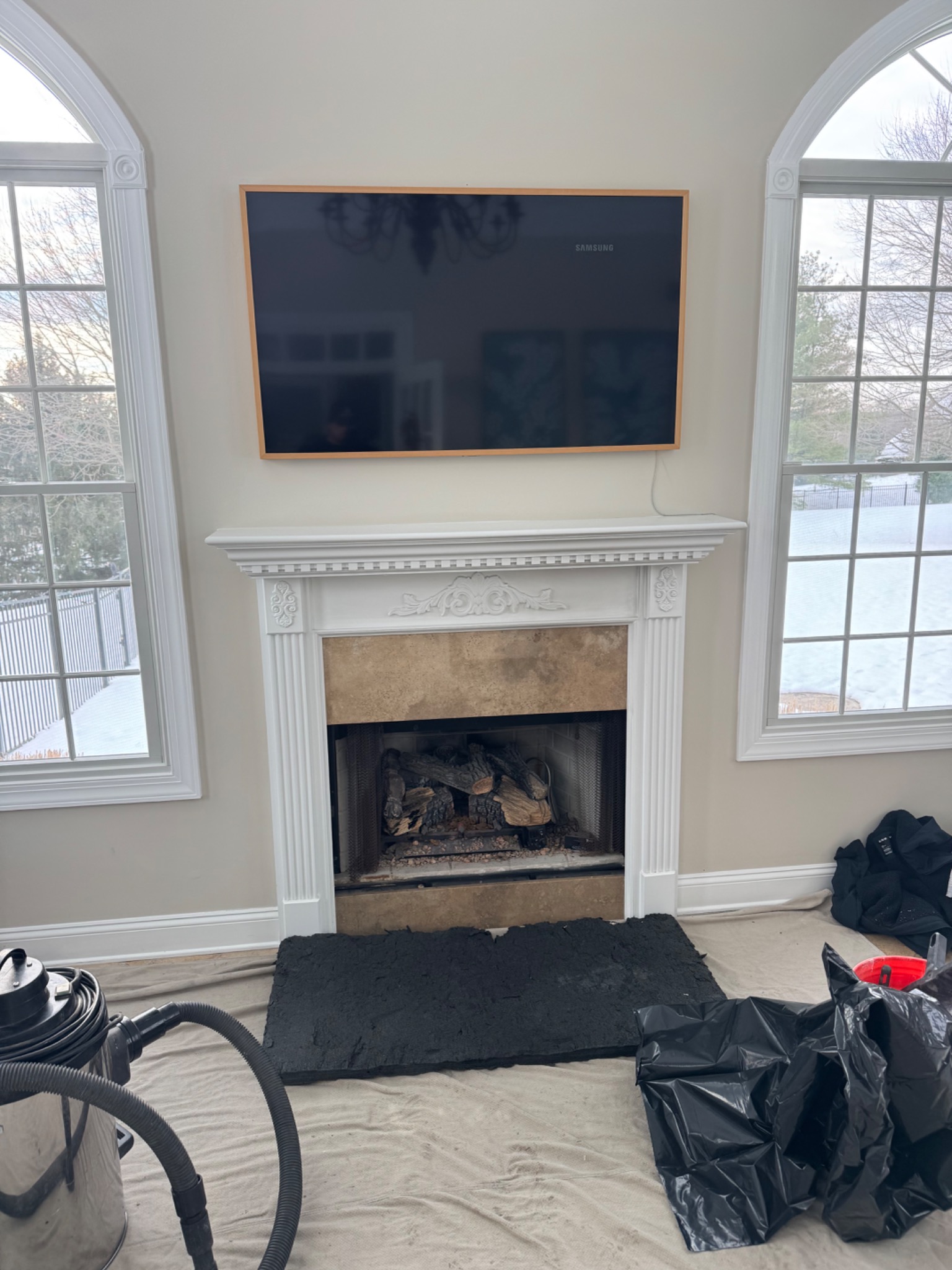 Before: open wood-burning fireplace before conversion