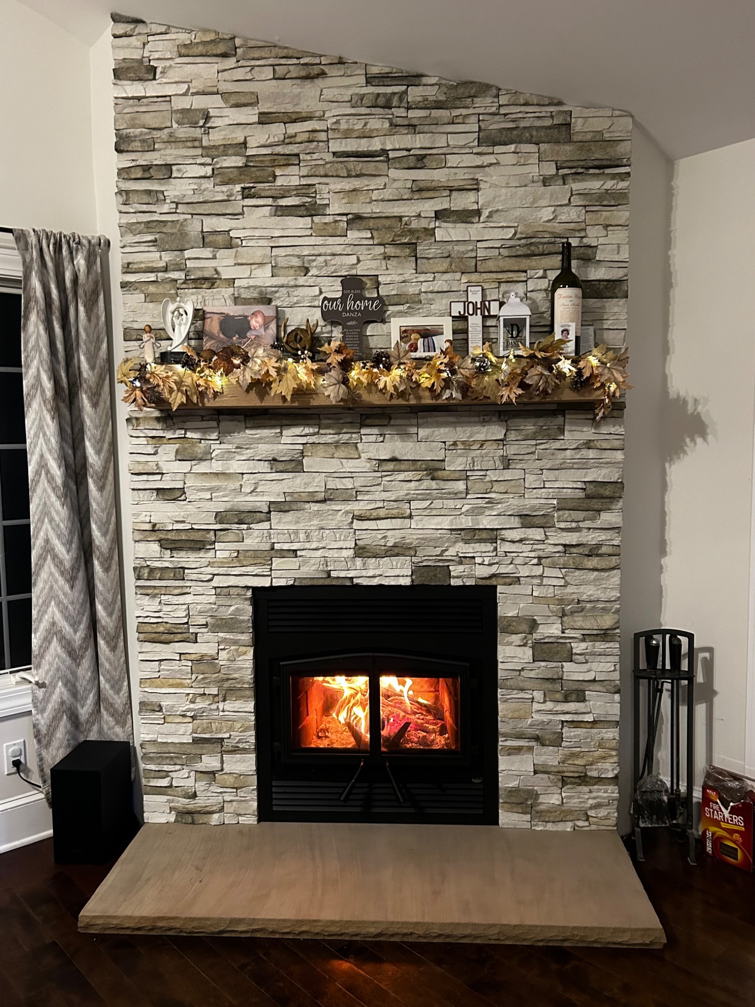 After: high-efficiency Majestic wood fireplace with stone veneer and hearth