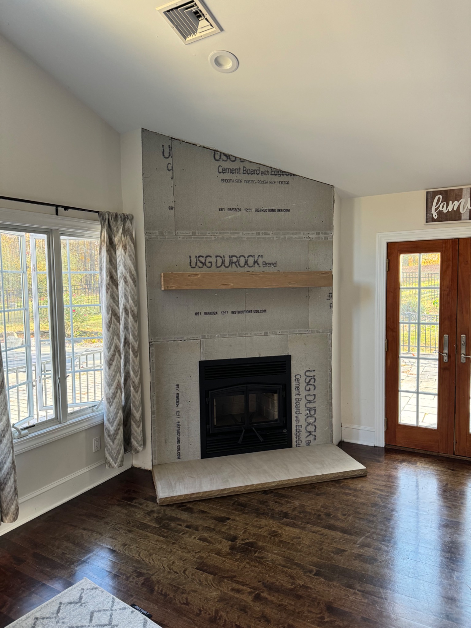 During: cement board, hearth, and mantel installation