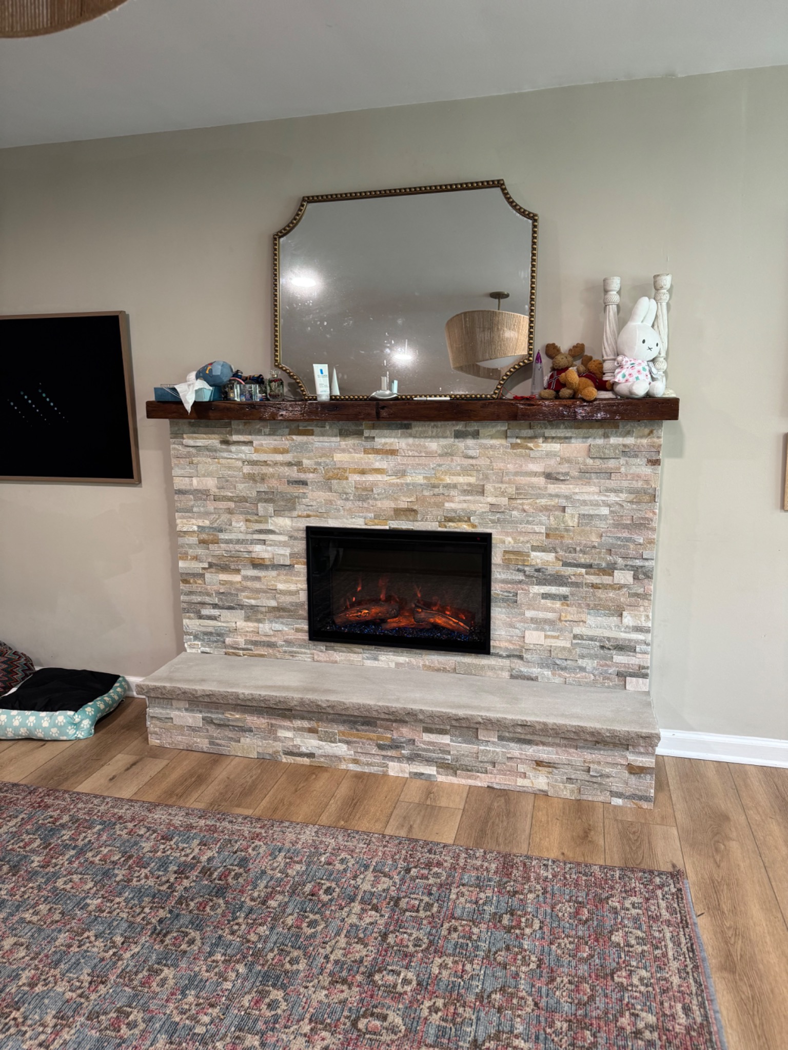 After: RedStone electric fireplace with new veneer stone and hearth