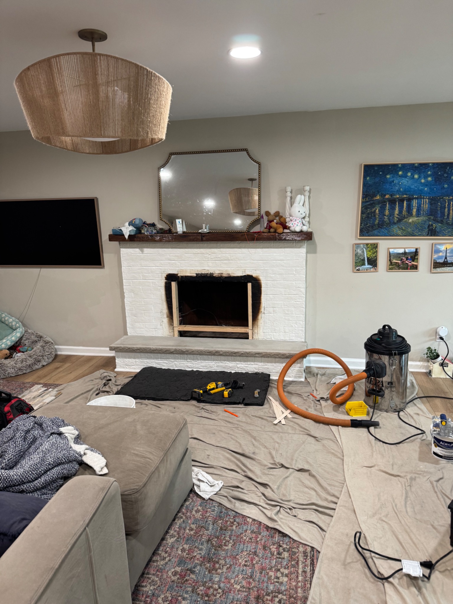 Before: white painted brick fireplace during preparation