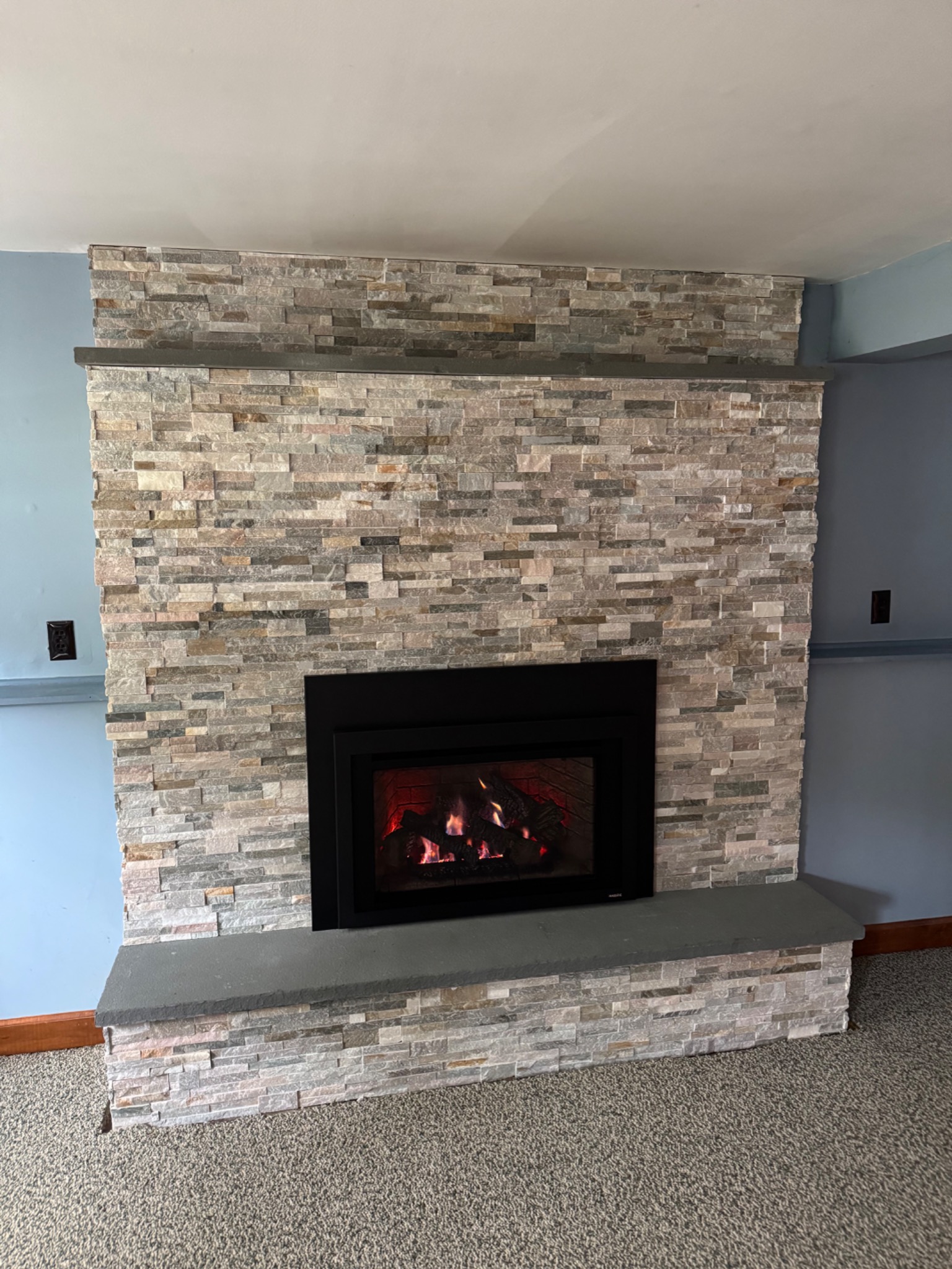 After: Majestic Trilliant gas insert with new stone veneer and hearth