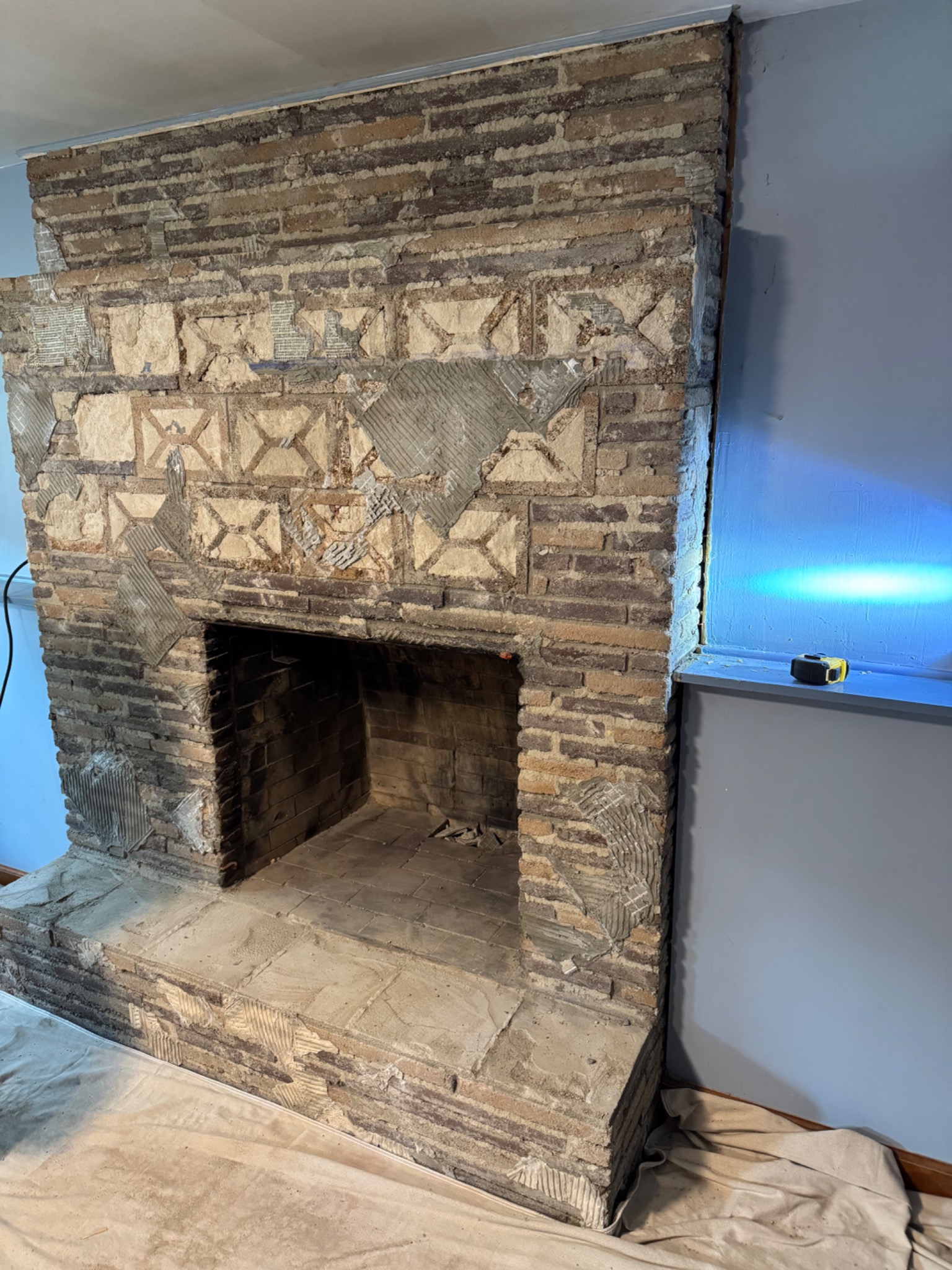 Before: old masonry fireplace stripped for renovation