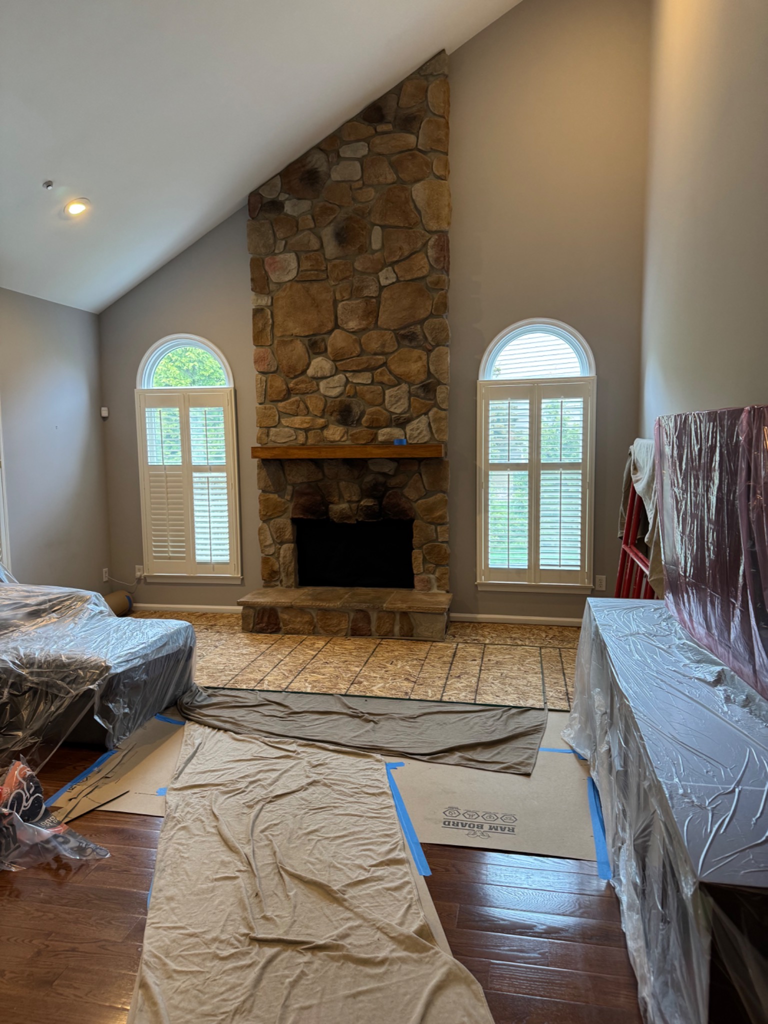 Before: prefab wood-burning fireplace with old stone veneer