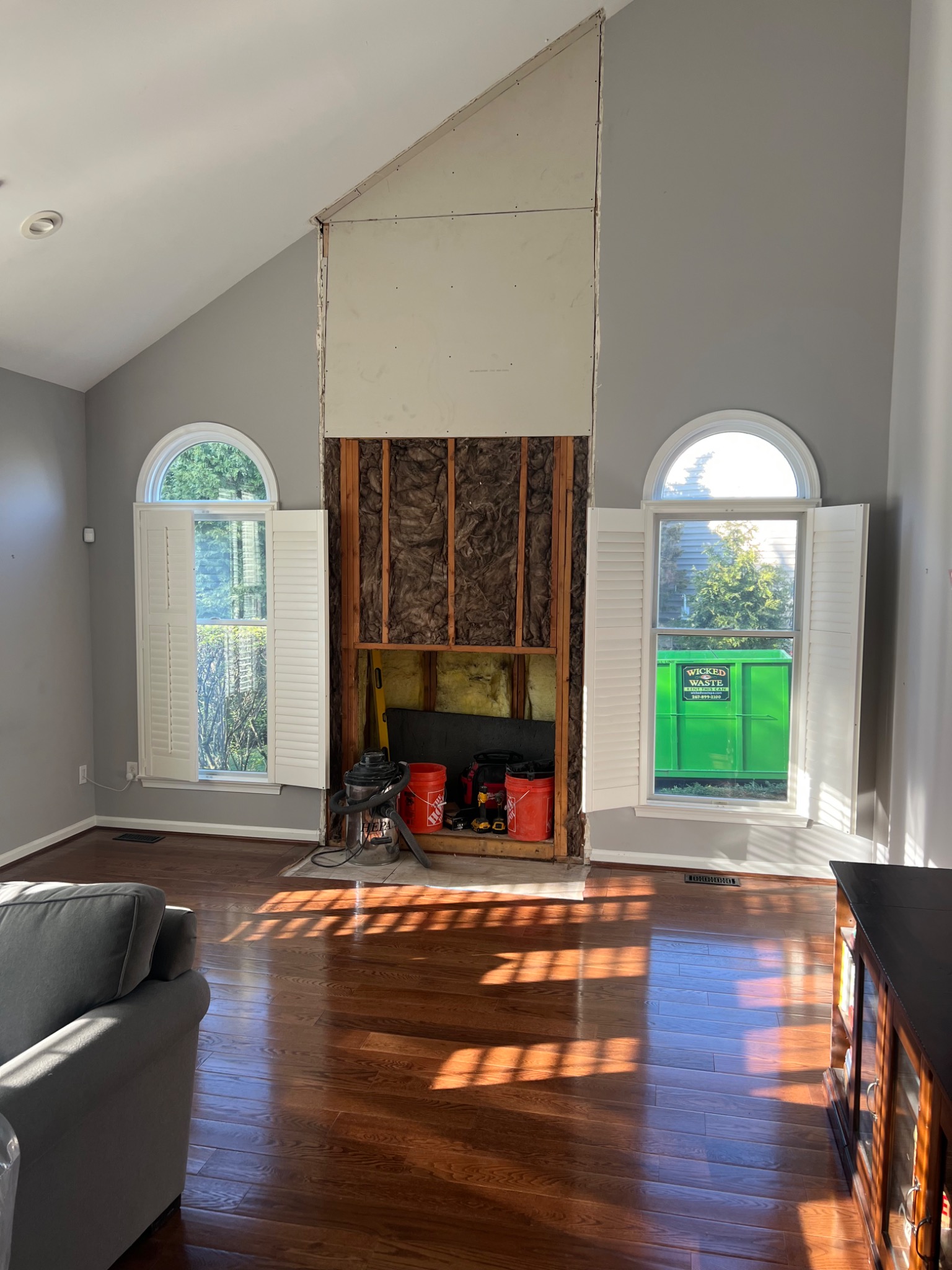 During: old fireplace removed and wall opened for new installation